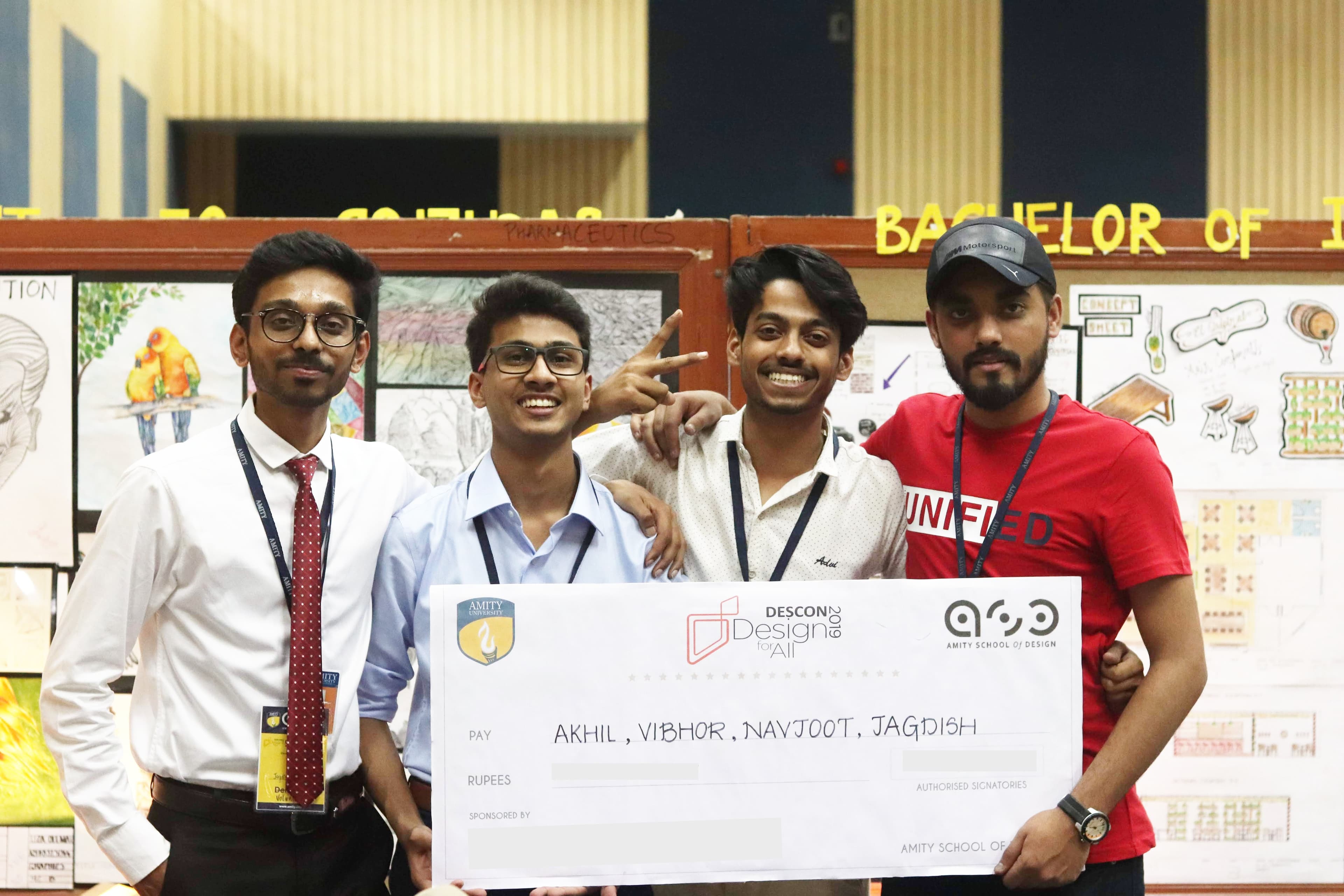 The PULSE team holding the DESCON 2019 prize cheque